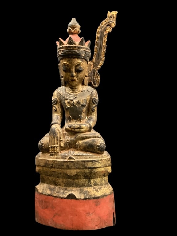 Seated Shan Style Buddha: Burma, 19 th century. Shown in Crowned Buddah form. Depicting his regal attire. Carved wood figure, 16 inches tall, showing earth touching gesture. , lacquer paint with traces gilting. * missing a