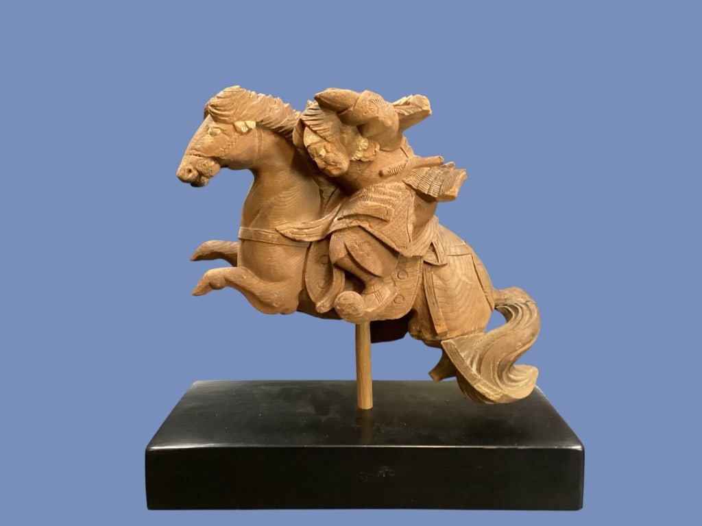 Japanese Wood Carving of Samurai: Hand carved sculpture of samurai warlord, traditionally made from elm or boxwood. Depicting a historical or legendary figure. Shown here in dynamic pose, as in the intensity of battle. 11 x 13 inches 