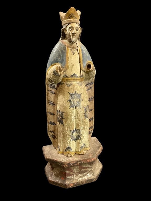 Philippine Santos Statue: Carved Wood Figural Statue, Spanish Colonial period. Religious Icon of a venerated pope or bishop. 19 inches tall with polychrome robe with crown. Stands on a carved pedestal or niche stand. * has