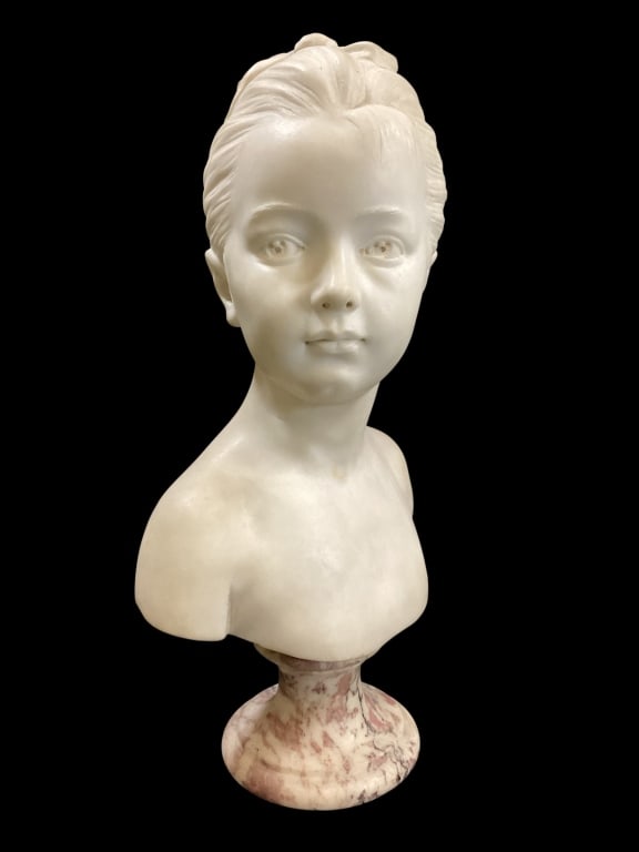 Marble Bust of Young Girl: After Houdon, marble sculpture bust of young woman said to be Louise Brongniart, model of the renowned sculptor Depicts sweet expression with upswept hair in ribbons18 inches tall, mounted to viewed