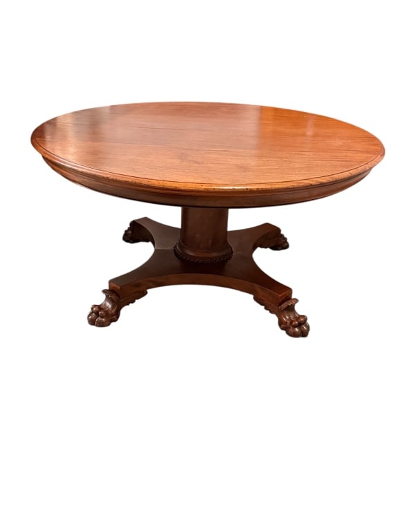 American Empire Mahogany Pedestal Dining Table: Fine antique 19th-century American Empire period mahogany expandable pedestal dining table. Features a round, multi-plank solid wood top with a molded edge over a thick, cylindrical pillar pedestal