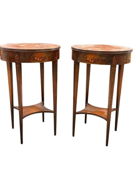Pair of Antique Painted Round Accent Tables: Pair of antique Sherwood or Edwardian Revival style round wooden accent pedestal tables. Each table features a circular top above a deep apron decorated with hand-painted floral swags and green