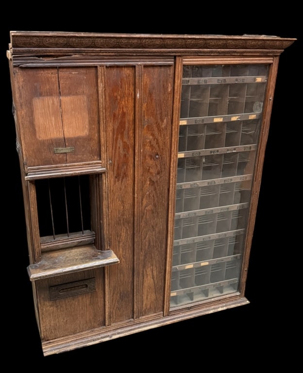 Country Store Post Office Counter-Top Window: With postmasters window with mail slot flanked by glass window housing 40 individual mail addresses/cubby-holes, additional cubbies above postmaster window, with brass plate for the Postmaster Supply