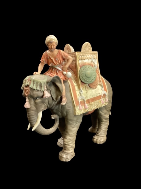 Royal Dux Porcelain Elephant: Royal Dux porcelain elephant with rider, large 12 x 13 inches, distinctive matte colors, know to Royal Dux, with intricate craftsmanship. - ()