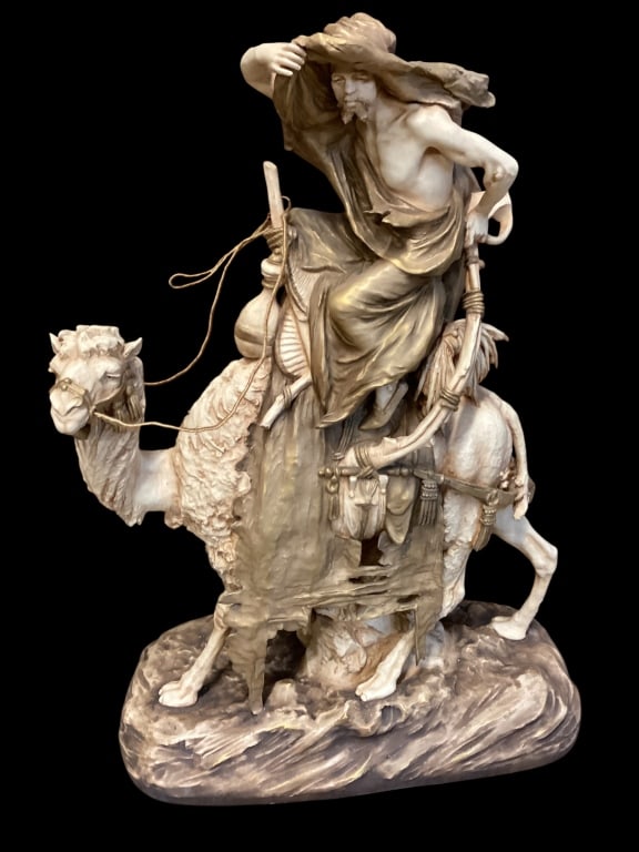 Turn Teplitz Amphora Porcelain: Impressive Size Arabian Rider on Camel porcelain Figural. Attention to detail is exhibited in this realistic form. Measures 24 x 17.5 inches. Desert colors, red seal mark for Reissner-Nordström, 