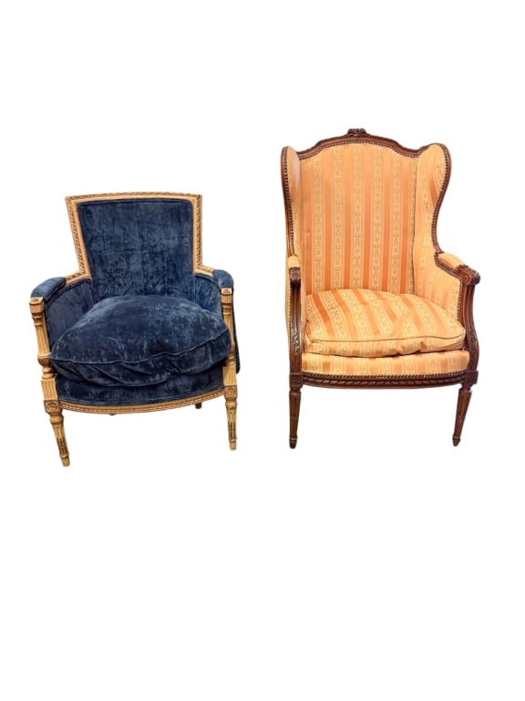 Two Antique French Louis XVI Style Armchairs: The first is a classic bergere wingback chair featuring a carved walnut-finished frame. It is designed with an undulating serpentine crest rail adorned with a central floral carving, fluted side