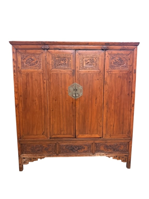 Antique Chinese Carved Elm Wedding Armoire: Impressive antique 19th-century Chinese Qing Dynasty wedding armoire cabinet crafted from solid fruitwood and pine with a rich, natural oiled finish. The upper section features four front panels,