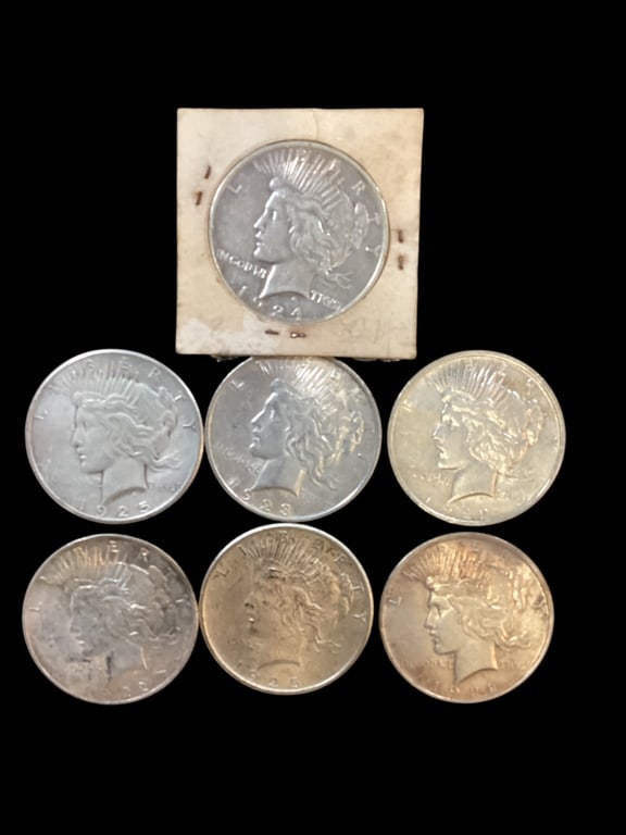 Seven Peace Silver Dollar Coins: Dates 1922, 23,24, 25. - ()