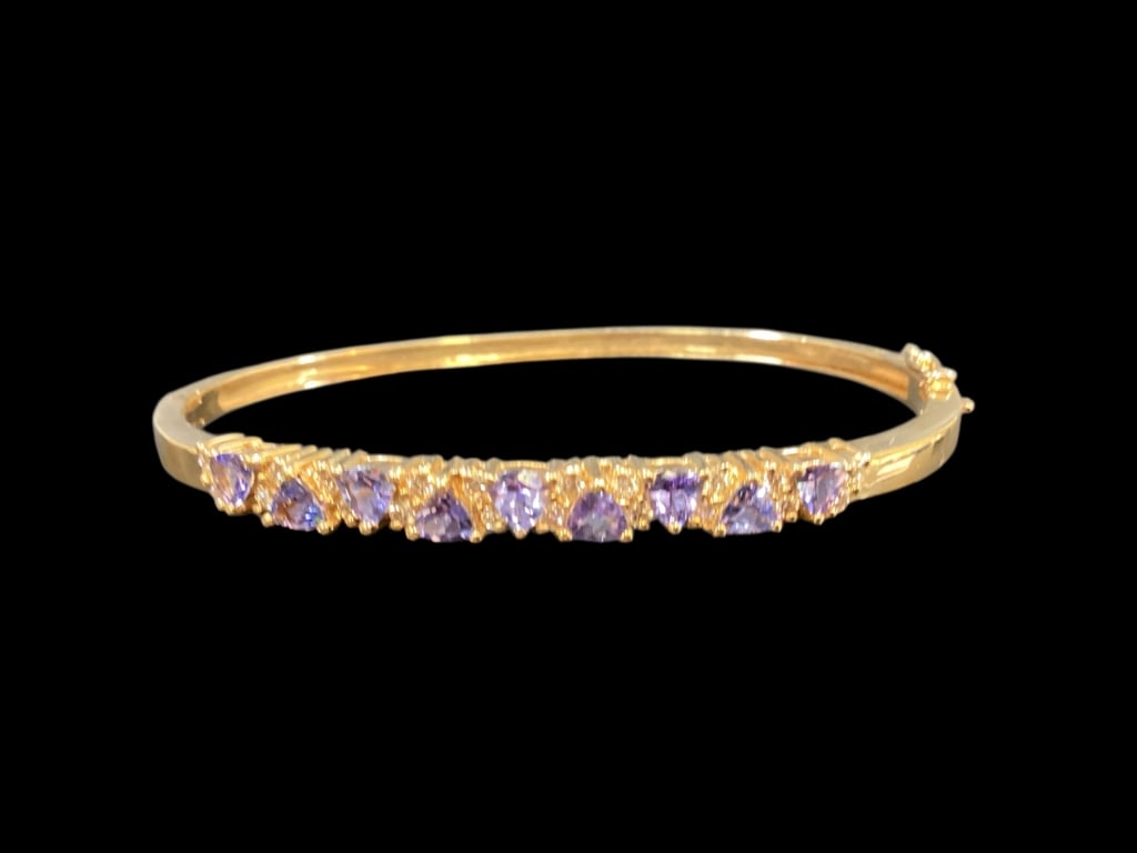 14 K Tanzanite Bangle Bracelet: Yellow gold with round and heart shaped gemstones with diamond accents. Marked 14 k 585 - ()