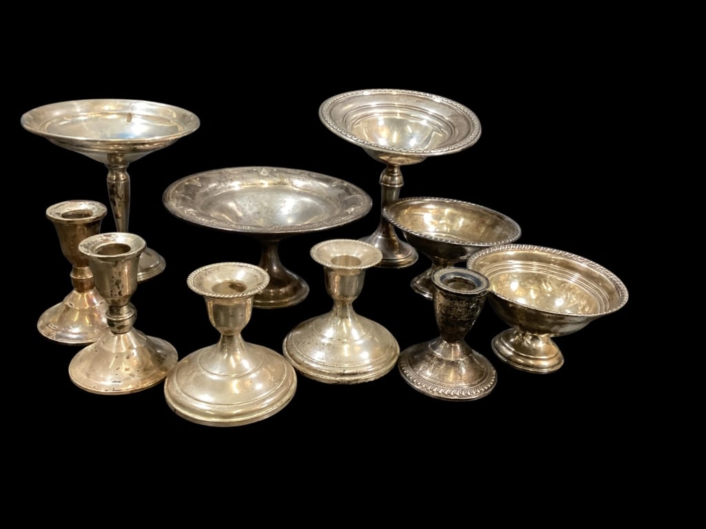 Ten Pieces Weighted Sterling Silver: Five pedestal compotes, 2 pair and one single candlestick. - ()