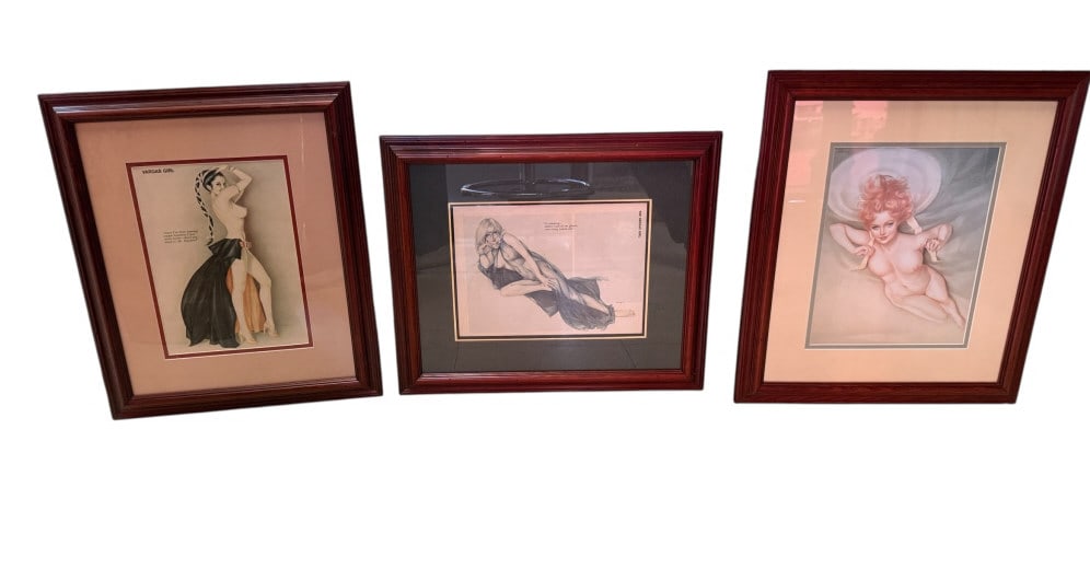 Three Framed Alberto Vargas Pin-Up Prints: Three Framed Alberto Vargas Pin-Up Prints Print 1 (Redhead): A full nude pin-up depicting a reclining redhead woman resting on a large white sun hat, signed "Vargas / 1950" in the plate. Print 2 (Blon