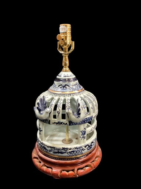 Porcelain Birdcage Lamp: Porcelain Birdcage Lamp Features a domed reticulated design, in Chinoiserie style blue and white , with sculpture birds, rests atop a brown wooden pedestal. 18 inches tall * missing harp Line Item # 1