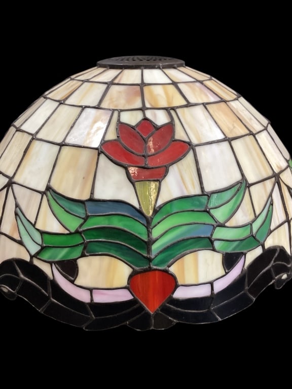 Leaded Stained Glass Shade: Leaded Stained Glass Shade Designed after Tiffany, featuring Red tulips in a deco style pattern on cream slag panels. Black scrolling base rim. Intersecting with green foliate. Dome shaped, approximat