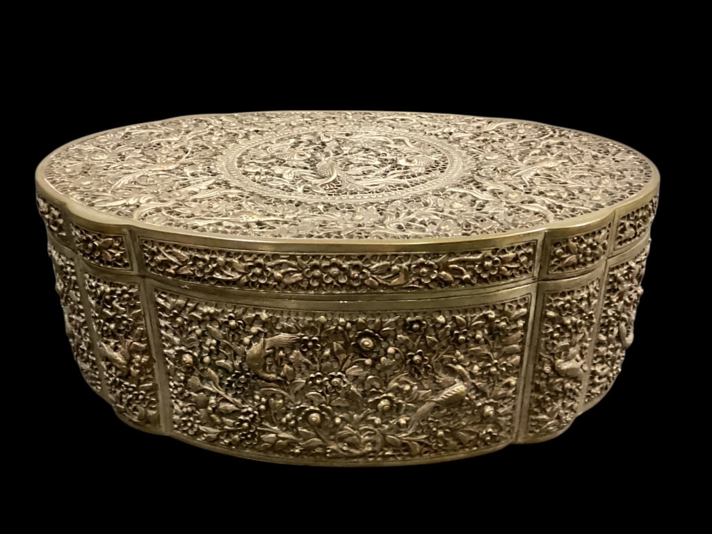 Chinese Silver Jewelry Box: Chinese Silver Jewelry Box Attributed to Straits Silver, bearing the hallmark for Sheng Xing, beautiful Repousse oval lidded box, open work and relief profile. Intricately decorated with fish and