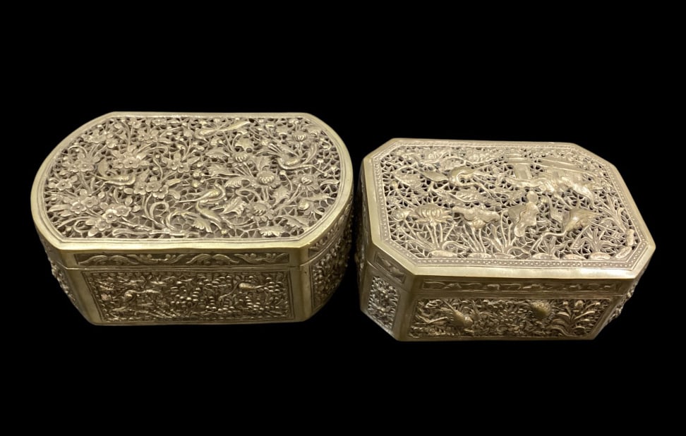 Two Chinese Silver Table Boxes: Two Chinese Silver Table Boxes Reticulated lidded box, open work filigree with birds and florals 6 x 4. Similar style reticulated box, lift lid, decoration of cranes, botanicals and clouds. Smaller si