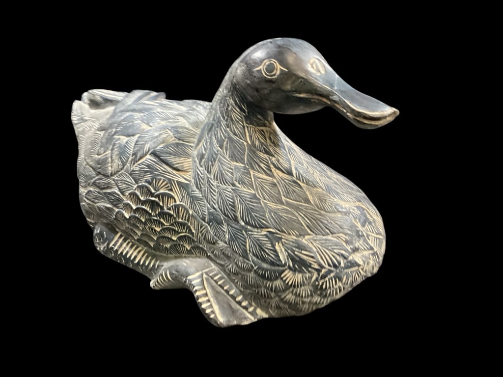 Large Carved Duck Sculpture: Large Carved Duck Sculpture Hand carved wooden duck, with a dense layered feather design, textured to simulate plumage, dark blue green finish with weather style appearance. Large size 25 x 14
