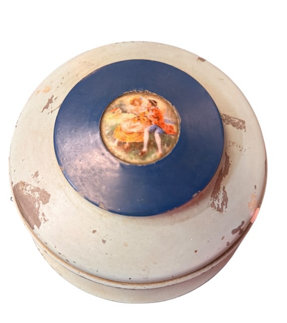 Vintage Musical Powder Box with Glass Liner: Vintage Musical Powder Box with Glass Liner Vintage mid-20th century round musical powder box or vanity dish container. The spun metal tiered body features a pale mint green enameled finish, topped