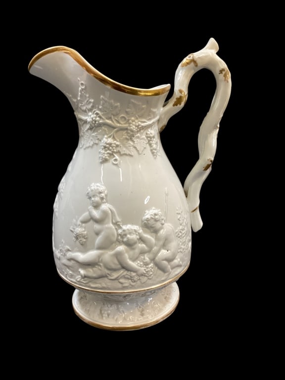Victorian Porcelain Pitcher: Victorian Porcelain Pitcher Pickman antique Jug, relief decorated with Playful cherubs in garden setting, clusters of grapes hang from twisting vines, with a braided tree branch handle. Base mark Pick