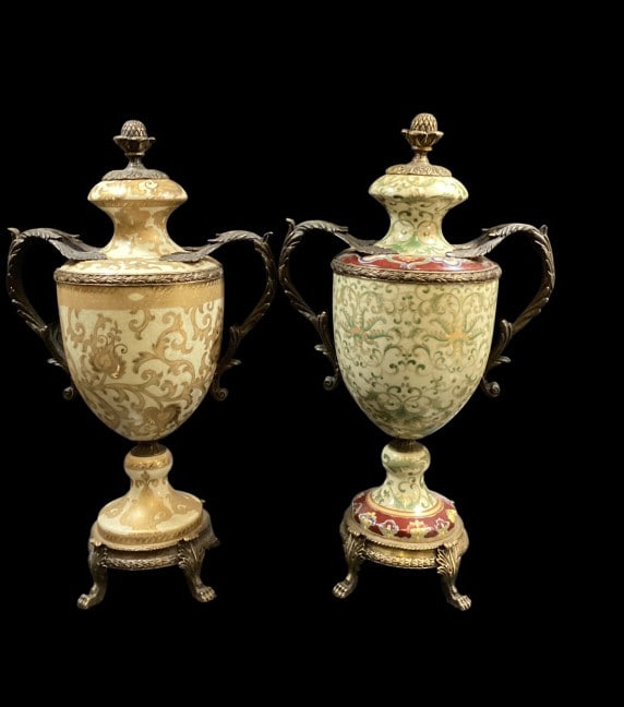 Pair Bronze Ormolu Lidded Urns: Pair Bronze Ormolu Lidded Urns Designed after French Neoclassical cassoulet designs. Scrolling Acanthus Leaf metal handles, a pedestal base, resting on paw feet. Each urn at 20 inches tall. One with