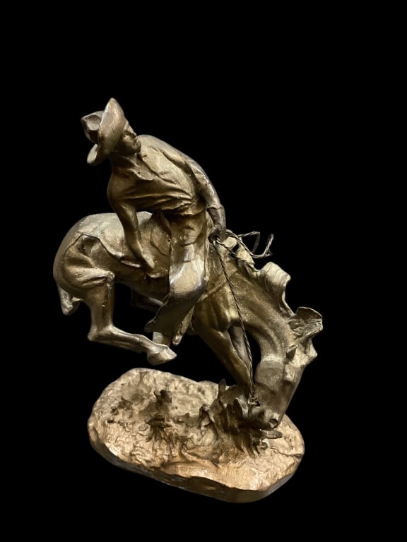 Bronco Buster Bronze, After Remington: Bronco Buster Bronze, After Remington Reproduction cast bronze sculpture of a cowboy riding a bucking bronco., after the original by Frederick Remington 7 x 6 inches,