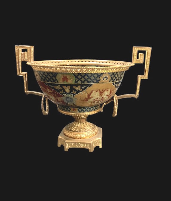 Imari Centerpiece Bowl: Imari Centerpiece Bowl Japanese Imari Formal Centerpiece bowl, mounted in French Louis XVI ormolu stand. The porcelain bowl showcases traditional colors red, blue and gold, with an intricate pattern