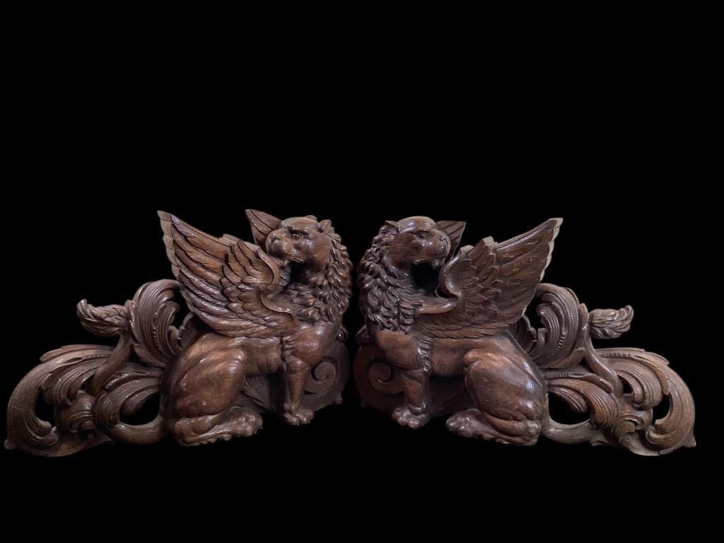 Pair Hand Carved Winged Griffins: Highly Detailed Carvings of mythical creatures, with feathered outspread wings, Lion like faces, large paw feet and curling tails. Typically rescued from Renaissance Revival furniture, this pair of