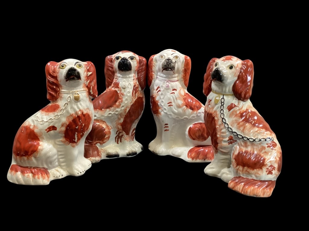 Staffordshire Spaniels: Four English Staffordshire Spaniel Figurals. Not matched pairs, but of similar size and color patterns, larger right and left facing dogs at 10.5 inches, rust red color, black faces. 2 front spaniels