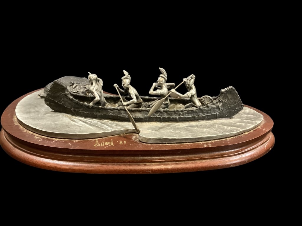 Fine Pewter Work Sculpture: Created by Artist Dan Pollard this sculpture titled Mohawk War Party, depicting three Native Americans figures navigating a canoe,11 inches in length, mounted to a wood plinth. Signed by Artist and da