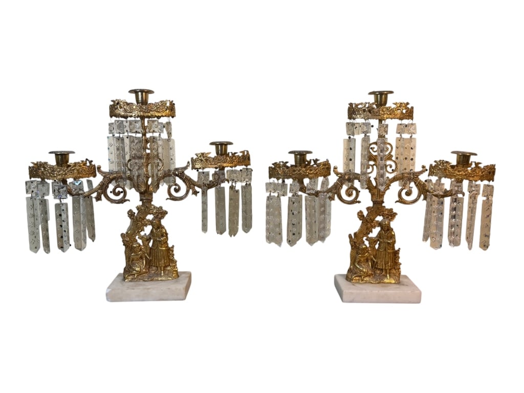 Two Brass Three-Branch Girandoles: Mid-19th-century pair of two gilt brass girandoles. The figural decoration depicts two shepherdesses with a sheep and combines Rococo and Classical Revival elements. The three-branch centerpiece