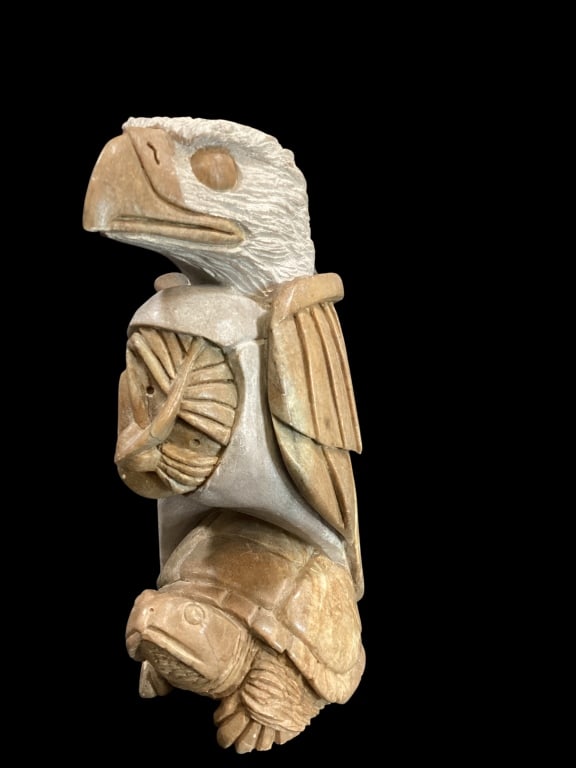 Indigenous Hand Carved Sculpture: Six Nation Carved animal fetish totem. Depicting an eagle, human face and turtle. These symbols represent Eagle as Guardian , the face as supernatural power, and the turtle for Turtle Island. Believin