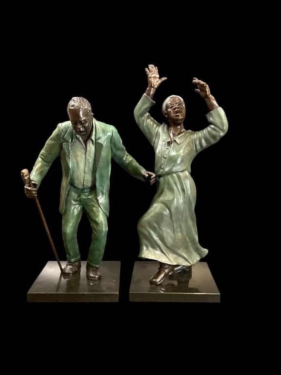 Pair Bronze Sculptures: Artist Judy Mooney has created two cold painted bronze sculptures, depicting Singers, Dancers in expressive forms. Joyfully singing with uplifted hands female figure, 20 inches tall. #4/20. Soulful