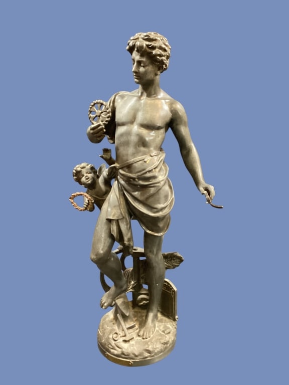 French Figural Sculpture, Emile Bruchon: Antique French sculpture, cast in patinated spelter with a bronze tone finish, depicting an allegorical male figure of Industry, accompanied by a cherub, while holding mechanical instruments. Signed i