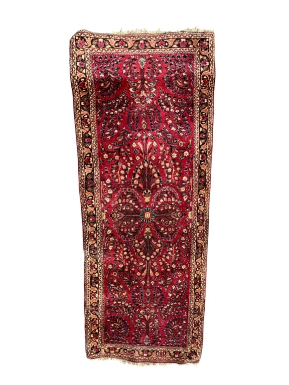 Sarouk Red Runner Rug: Vintage Persian Sarouk runner rug featuring a rich red field with a detailed floral and botanical medallion pattern. Intricate scrolling vines and floral motifs extend throughout the composition, fram