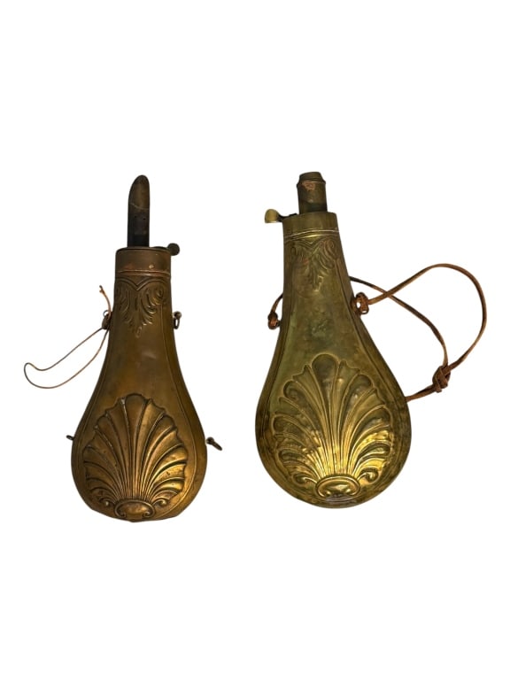 Pair of Civil War era Hawksley Powder Horns: Lot of two civil war era Hawksley powder horns. One larger brass horn and one copper, with both featuring embossed scallop. Both items are in good condition with minimal wear.