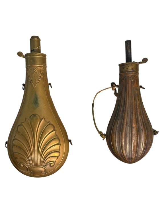 Pair of Civil War Era Powder Horns: Two Civil War era powder horns. One horn is brass with embossed scallop, and the other is copper with embossed patterning. Both items are in excellent condition.