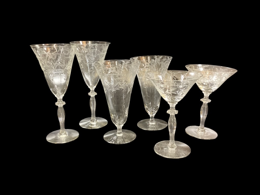 Collected Group Vintage Crystal: Attribution to Morgantown pattern features delicate cut florals with dot and line to bowl. 47 pieces in three sizes, 17 iced tea, 15 champagne stems, 15 water goblets