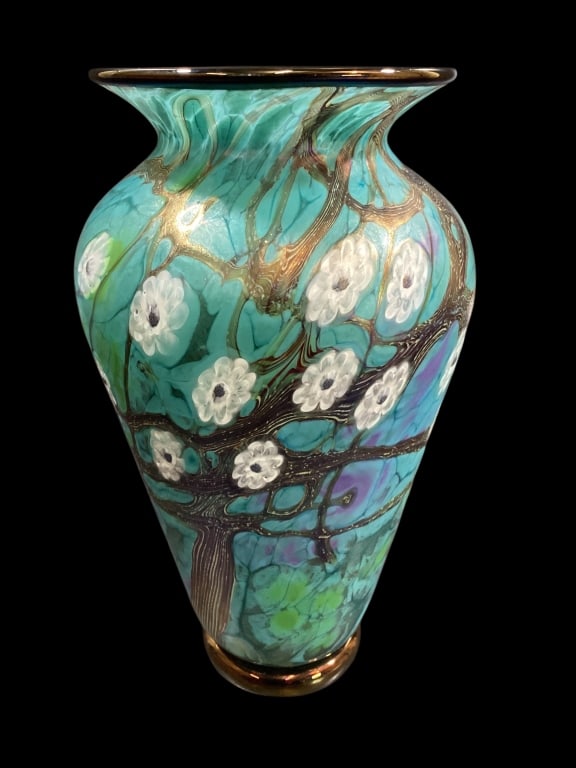 David Lindsay Art Glass Vase: Beautifully executed Art glass vase with Cherry Blossom design. Swirling tree branches with white blooms on a turquoise and green veined ground, 8.5 inches tall, lighted flared rim. Signed to base.