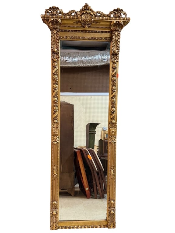 Large Giltwood Pier Mirror: Ornate vintage giltwood pier mirror featuring elaborate carved floral and scrollwork details. Dimensions: 86 x 33