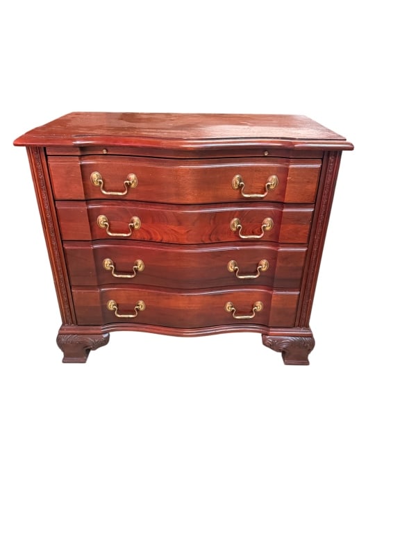 Wellington Hall Serpentine-Front Drawer Chest: Fine solid mahogany serpentine-front chest by Wellington Hall Caribbean Corp., labeled and made in Honduras of genuine mahogany. Four oxbow-front graduated drawers with brass bail pulls, a shaped