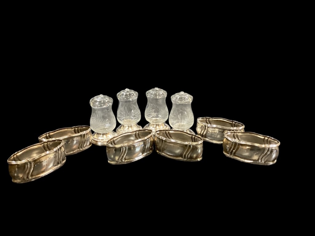 Weighted Sterling Shakers, Napkin rings: Set of 4 weighted Sterling base shakers by Quaker silver Co. pattern is Hurricane. Set of 6 napkin rings in 800 silver, Crown and Crescent engraved EB.