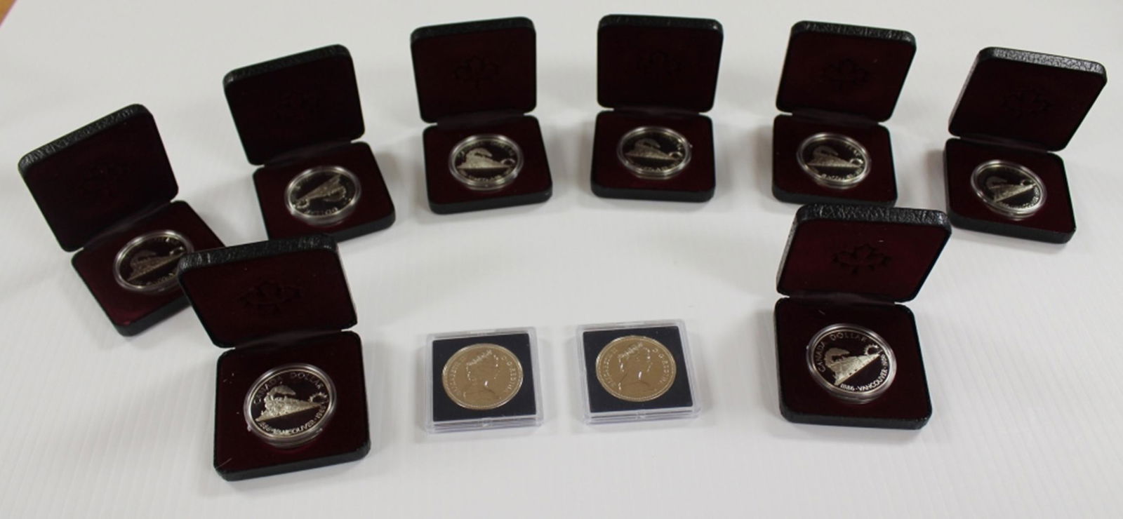 (10) MIXED CANADA 50% SILVER DOLLARS (1 of 1)