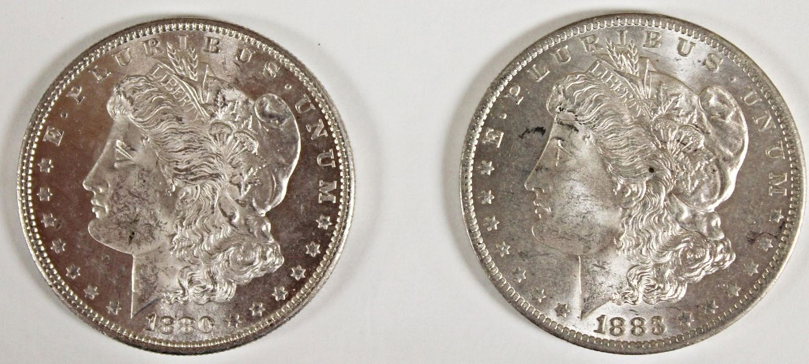 TWO MORGAN SILVER DOLLARS: 1883-O AND 1880-S (1 of 2)
