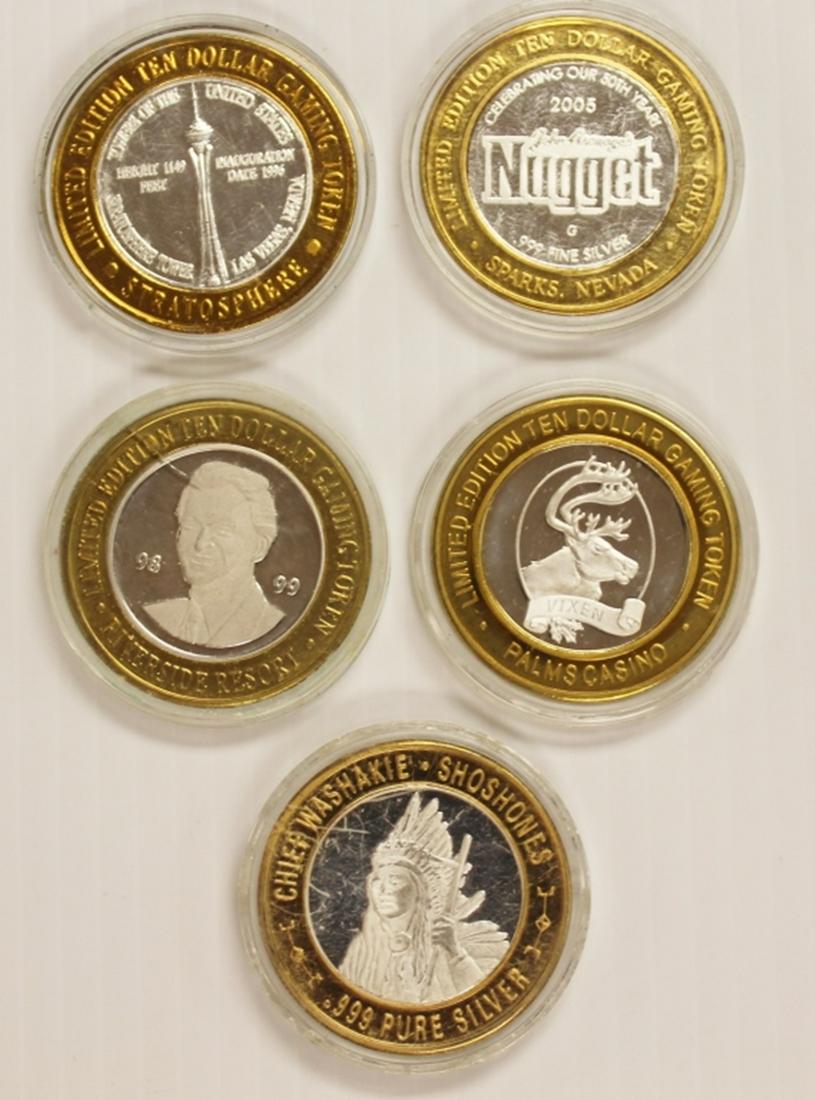 FIVE MISCELLANEOUS SILVER CASINO TOKENS (1 of 1)