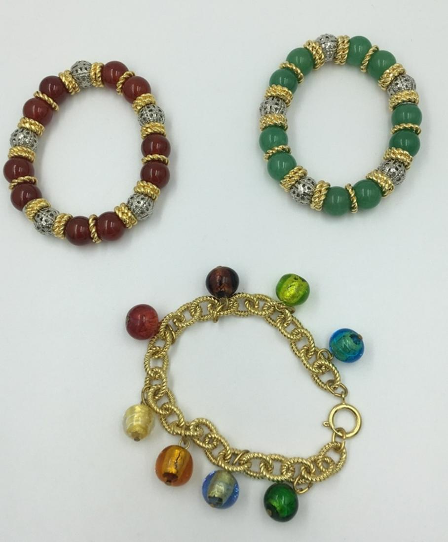 MISC. BRACELET LOT: 3 COLORFUL BRACELETS. GOLD TONED WITH DIFFERENT COLORED BEADS. SEE PHOTOS! PRE-OWNED. ESTIMATE: $100-$125