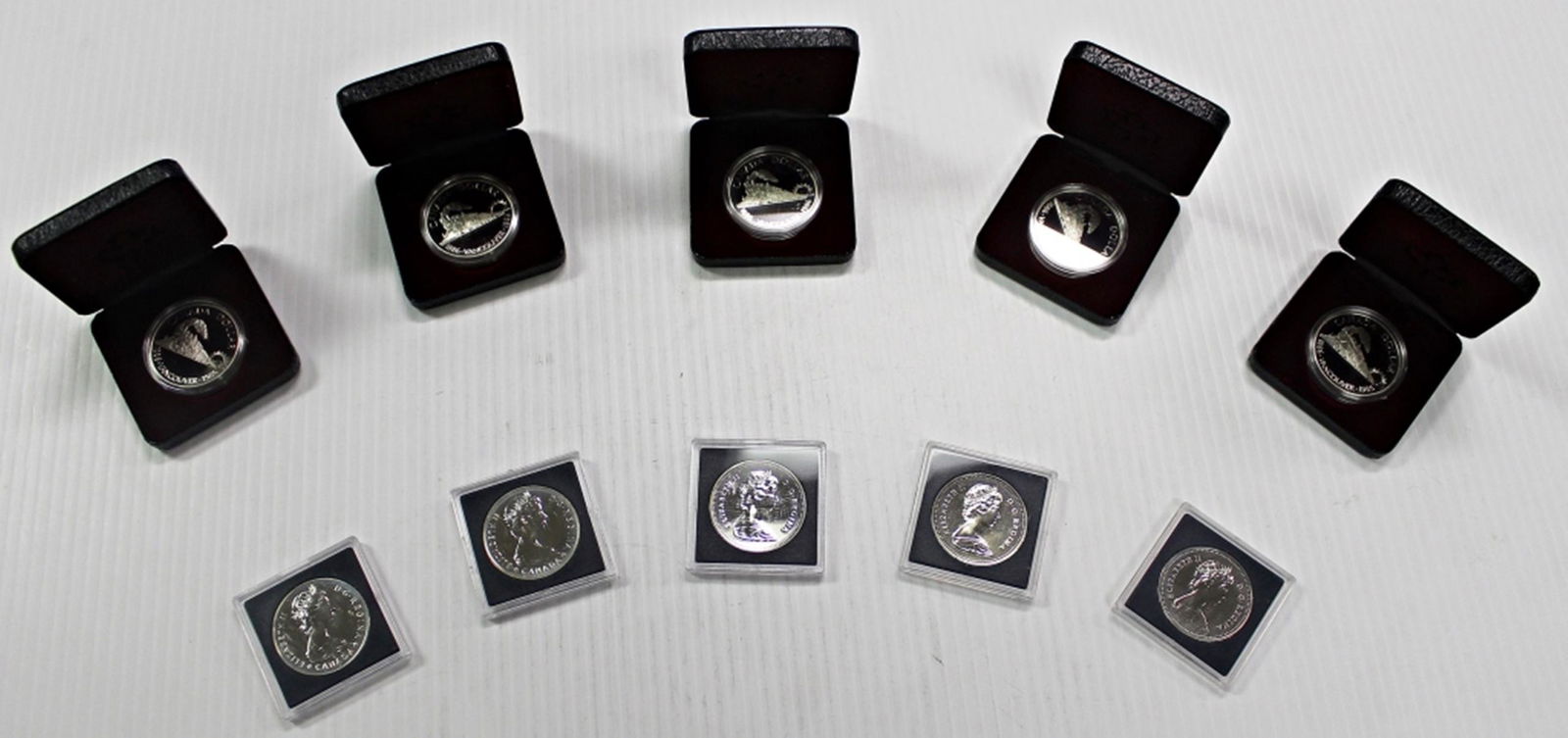 (10) MIXED CANADA 50% SILVER DOLLARS (1 of 7)