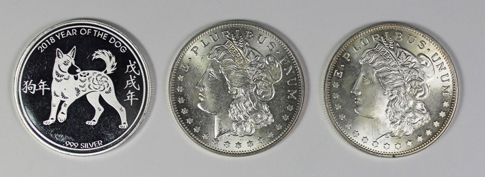 (2) MORGAN SILVER DOLLAR 1 OZ ROUNDS AND (1 of 2)