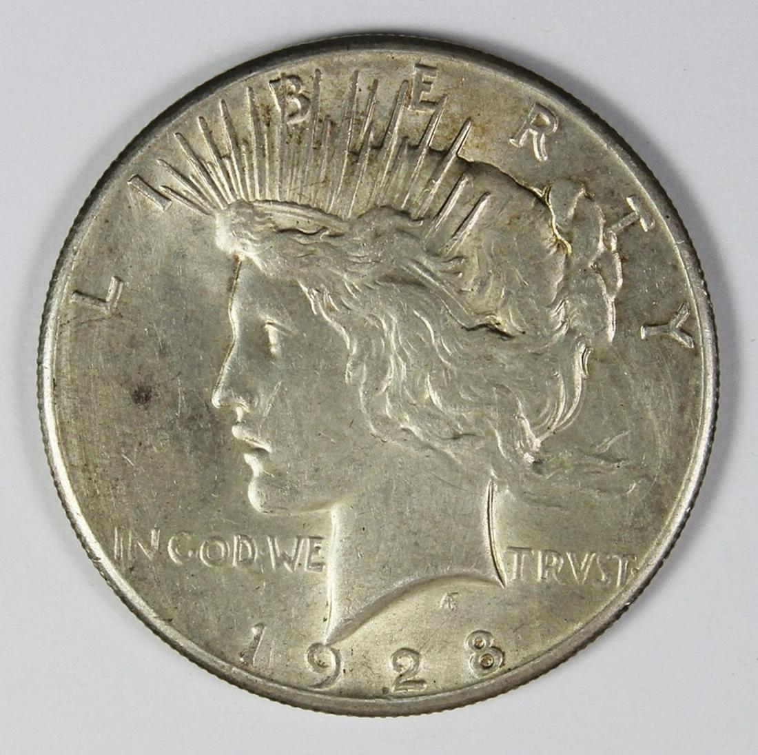 1928 PEACE SILVER DOLLAR: AU NICE KEY COIN! ESTIMATE: $325-$425