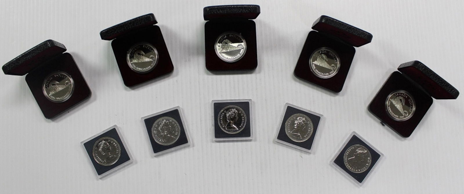 (10) MIXED CANADA 50% SILVER DOLLARS (1 of 9)