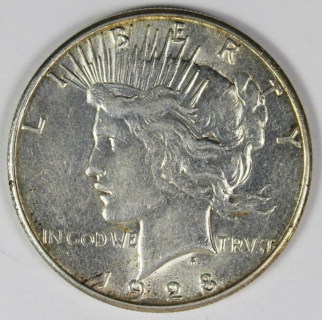 1928-S PEACE DOLLAR: AU/UNC. ESTIMATE: $100-$125