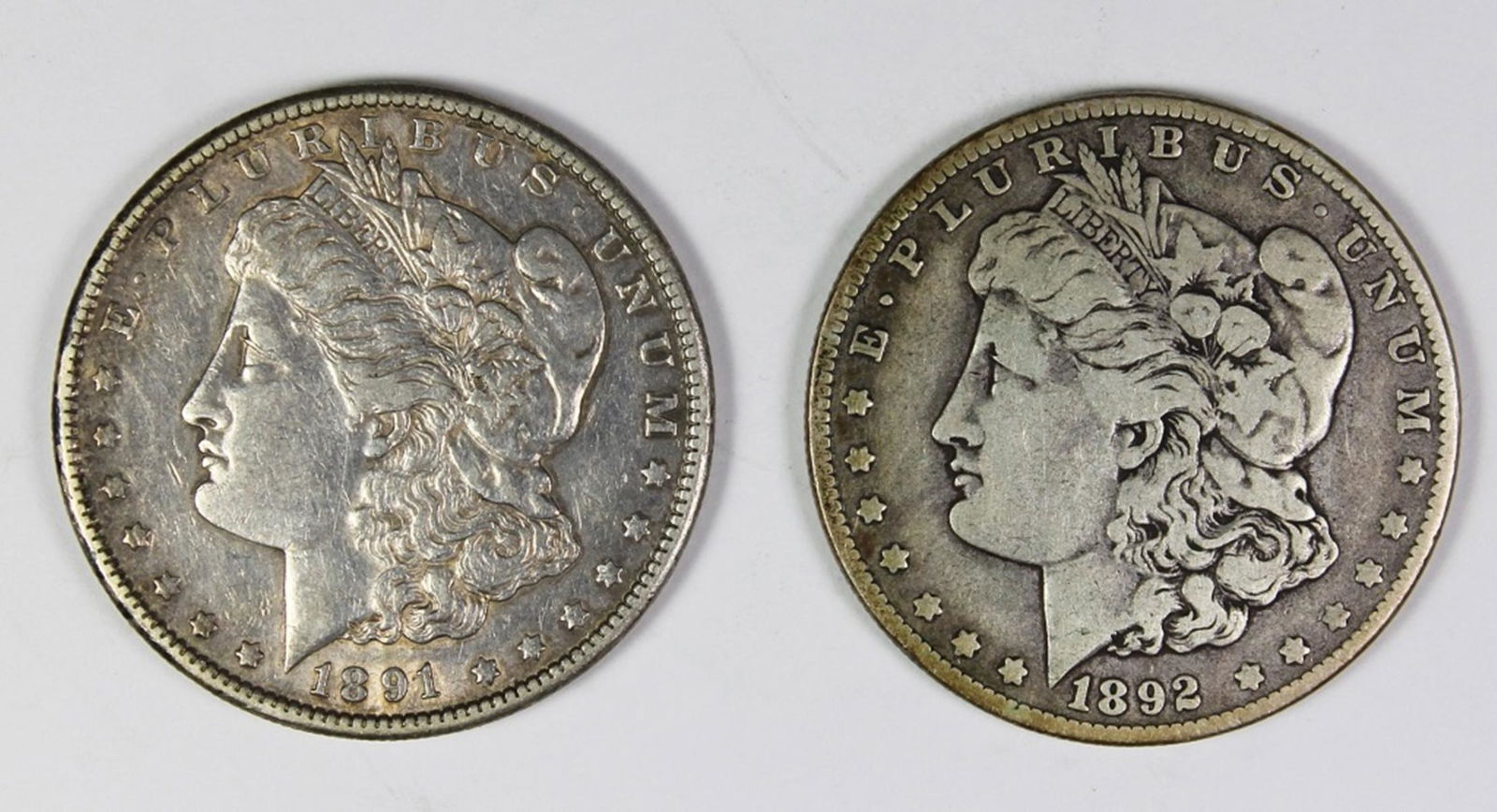 1891-S AND 1892-O MORGAN SILVER DOLLARS (1 of 2)